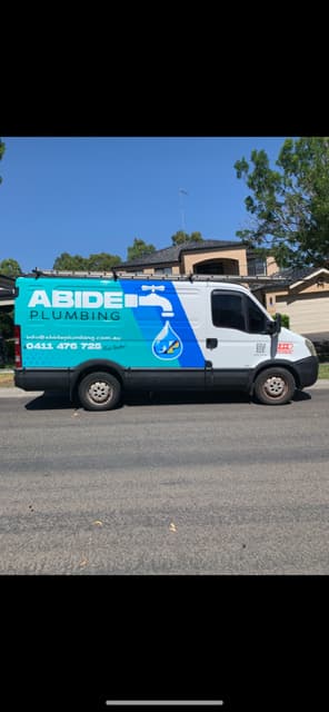 Abide Plumbing van parked on-site, showcasing trusted plumbing, handyman strata, commercial and residential services.
