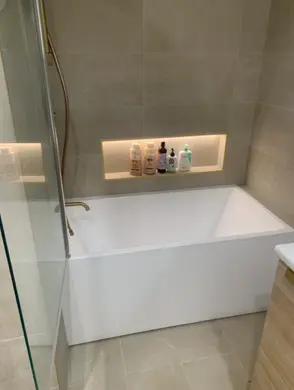 Full view of a residential bathroom following professional plumbing maintenance and fixture checks plumbing and handyman reviews