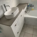 Professional plumbing assessment of a leaking bathroom vanity and bathtub installation in Kellyville.